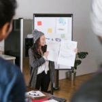 Pitch Business Plan - Woman Holding White Papers