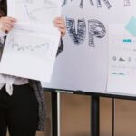 Components, Startups - Woman in Gray Coat Holding White Printer Paper