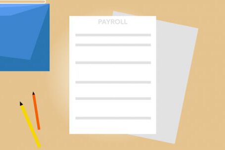 Business Plan Template - Payroll documents and calendar arranged on table with pencils